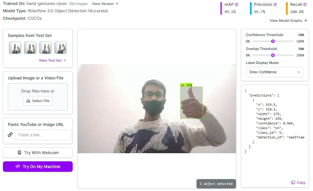 A person with a beard and glasses holding up his thumb
Description automatically generated